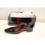 A pair of paten black & red shoes size 10