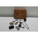 A wooden box and contents including a fob chain