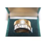 An unusual contemporary 18ct yellow & white gold ring, with a 0.53ct solitaire brilliant cut diamond