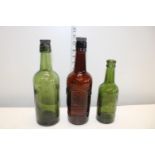 Three vintage advertising bottles