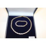 A costume jewellery necklace & bracelet set