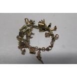 A 9ct gold charm bracelet with fifteen 9ct gold charms. 43.08 grams