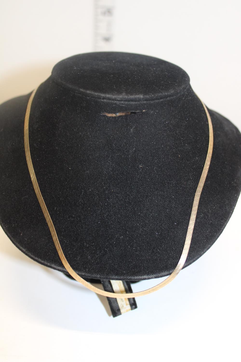 A 9ct gold band necklace 39cm long. 3.43 grams