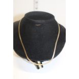 A 9ct gold band necklace 39cm long. 3.43 grams