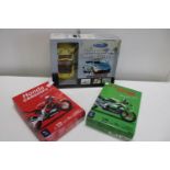 Three boxed DIY car and motorbike model kits (red one part built)