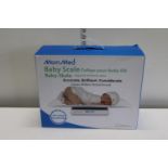 A boxed Mom Med electronic baby scale