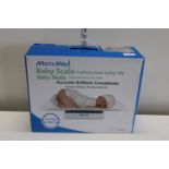 A boxed Mom Med electronic baby scale