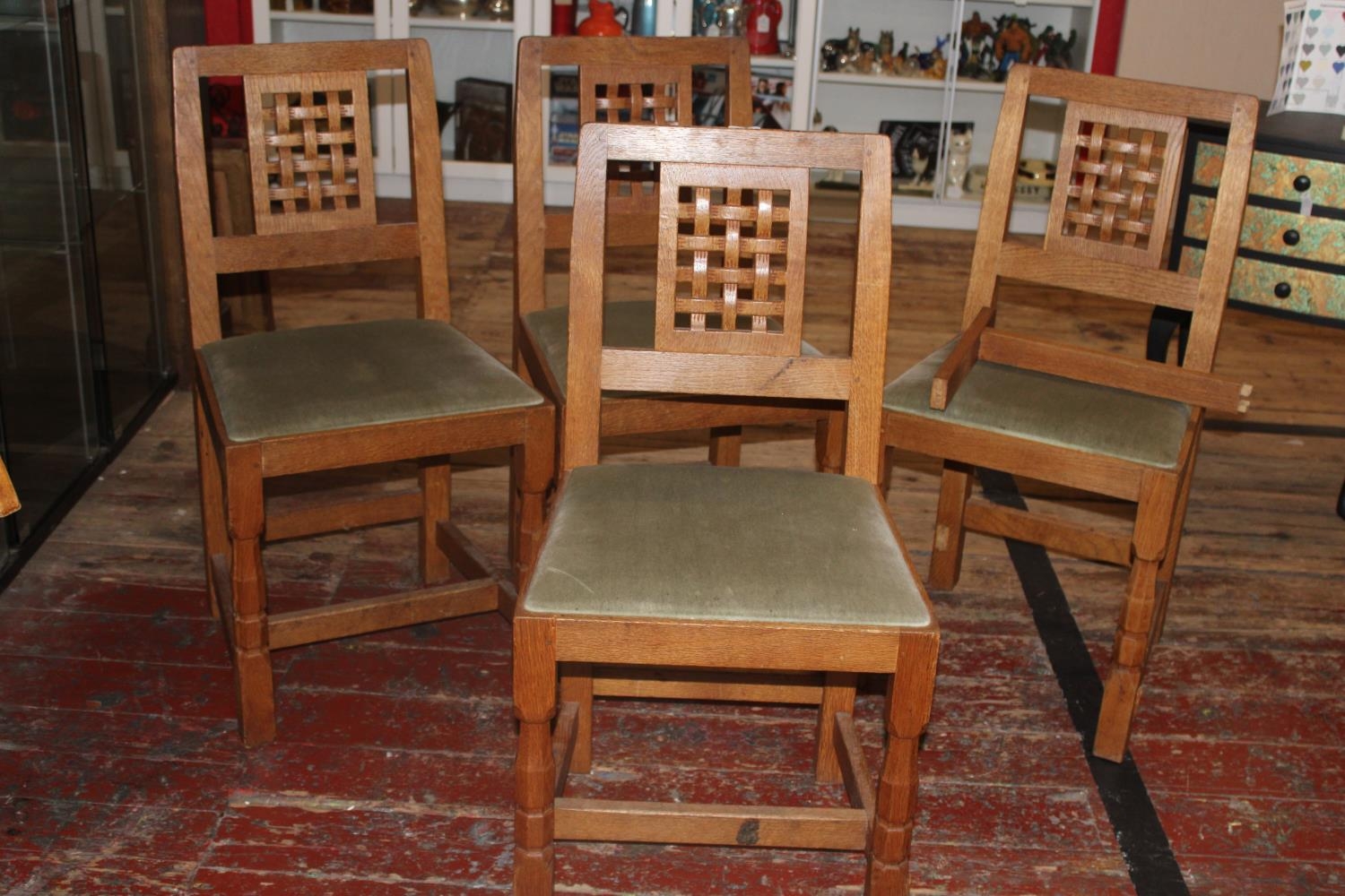 Four vintage Derek 'Lizardman' Slater oak dining chairs with lattice work backs. All with a carved