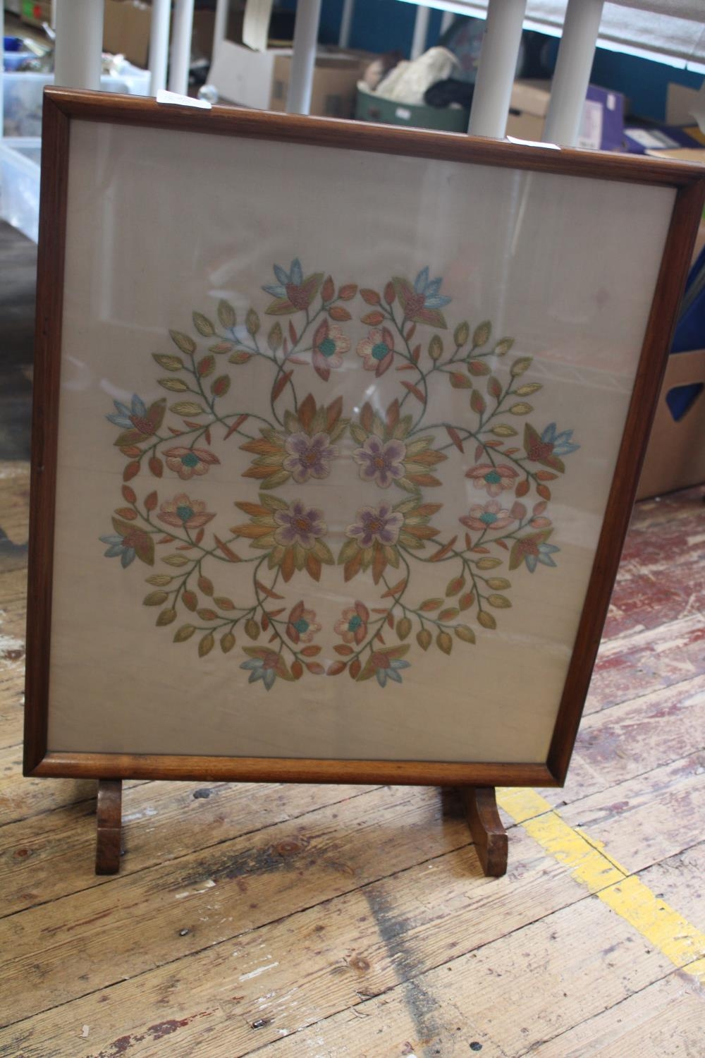 A Framed silk work fire screen. Postage unavailable