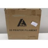 A roll of 3D printer filament in grey.