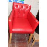 Red Upholstered retro style arm chair. Postage unavailable