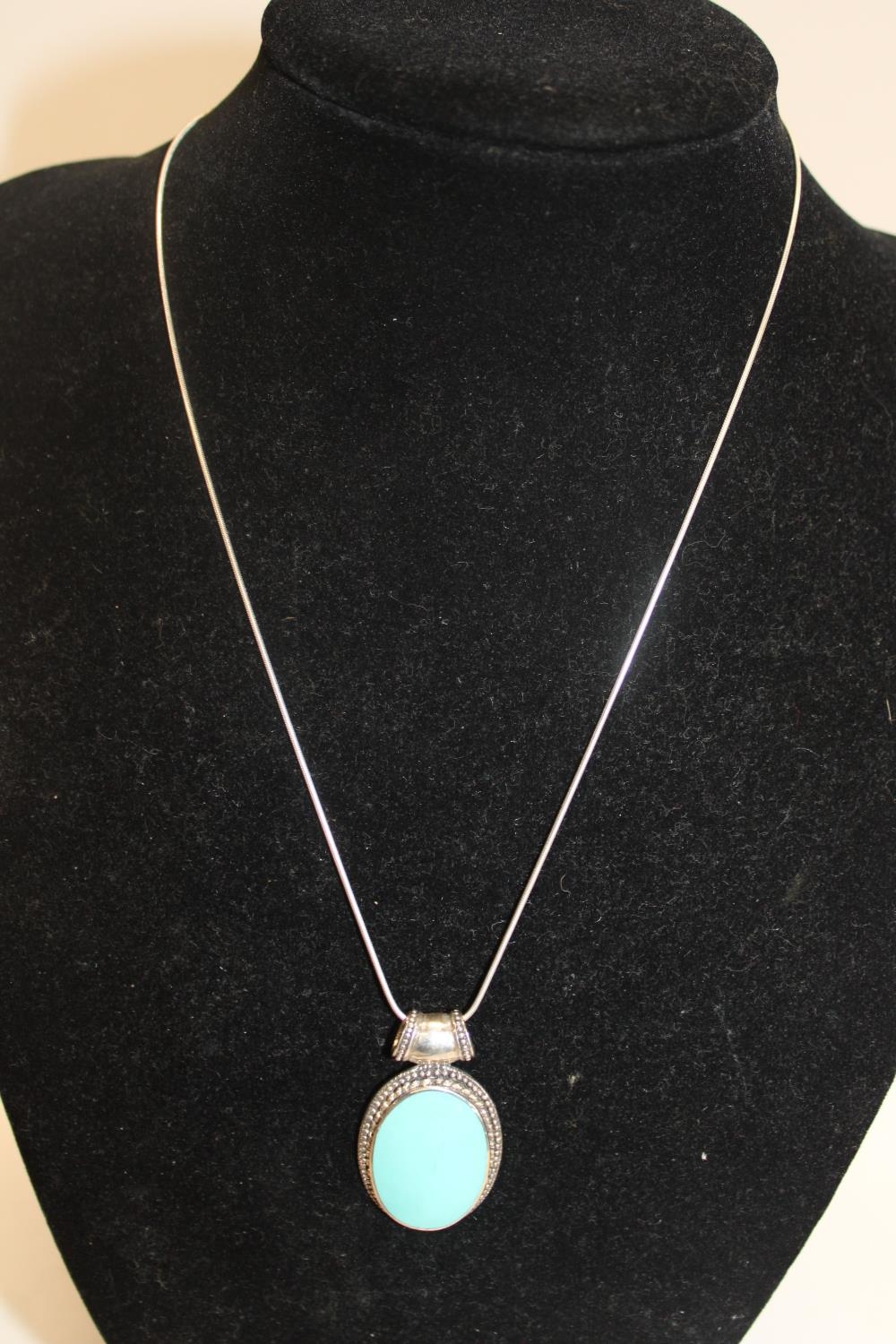 A 925 silver necklace & locket with a turquoise decoration