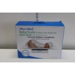 A boxed Mom Med electronic baby scale