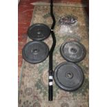 A curl bar & set of weights. Postage unavailble