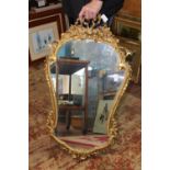 A vintage gilt framed wall mirror. Postage unavailable 92cm tall