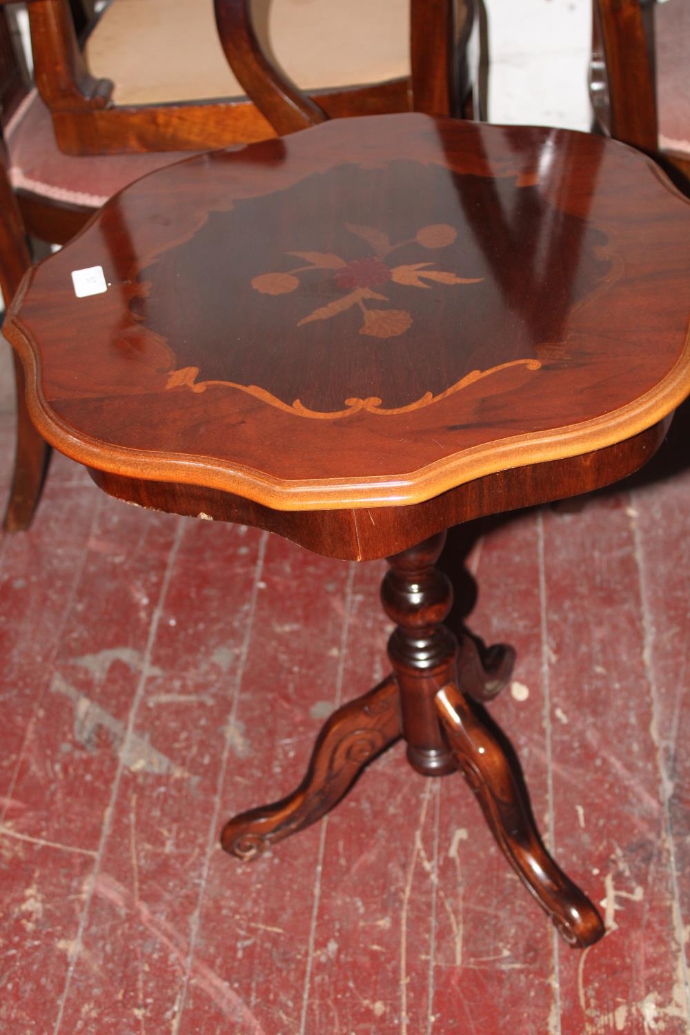 A vintage occasional table with inlaid top. Postage unavailable dia 52cm