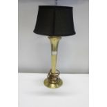 A stylish brass based table lamp