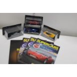 Four boxed die-cast models & magazines