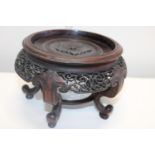 A large finely carved antique Chinese wooden vase stand