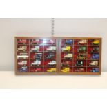 Two glazed display cases & contents of die-cast models