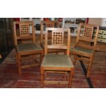 Four vintage Derek 'Lizardman' Slater oak dining chairs with lattice work backs. All with a carved