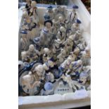 A large qty of blue & white ceramic figures. postage unavailable