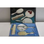 A vintage boxed silver plated dressing table set