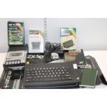 A vintage ZX Spectrum + and accessories etc
