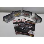 Four boxed F1 die-cast models & magazines