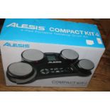 A boxed Alesis compact kit 4 drum set