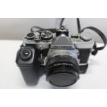 A vintage Olympus OM-1TR camera & lens