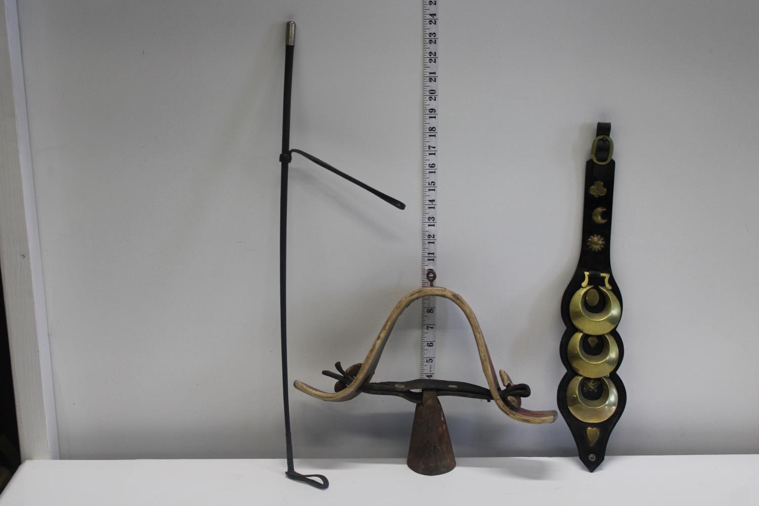 A mixed job lot, goat bell, riding crop & horse brass