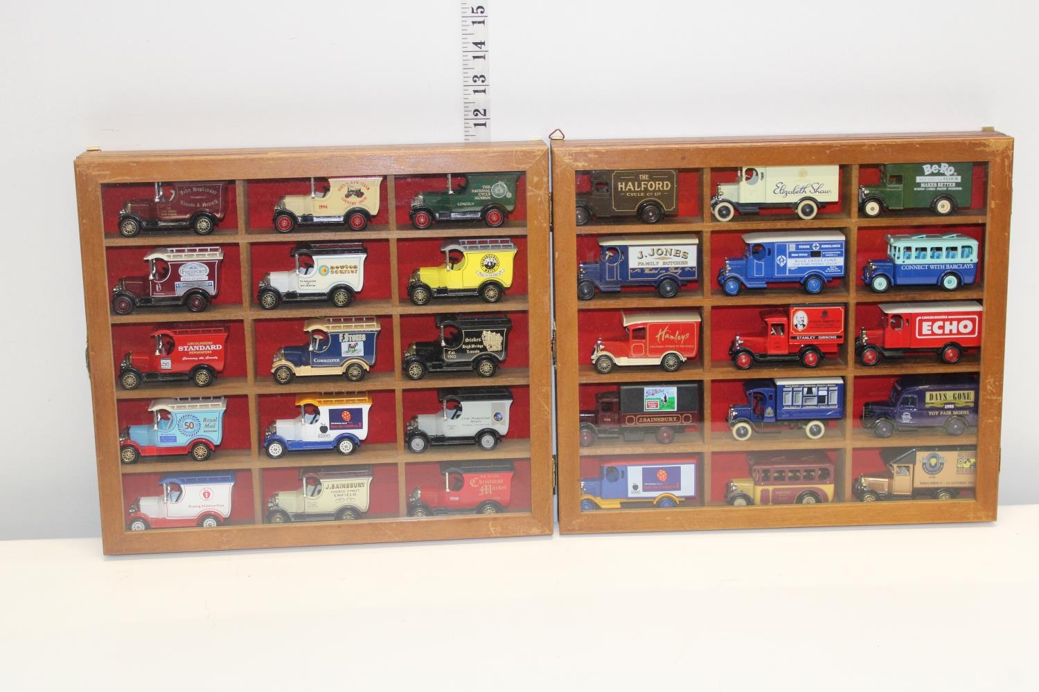 Two glazed display cases & contents of die-cast models