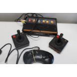 An Atari flashback game console & controllers plus a Saga controller