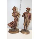 A pair of cast metal figures