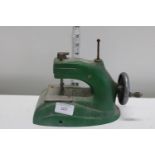 A vintage child's toy sewing machine