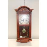 A wooden cased Lincoln 31 day wall clock. a/f postage unavailable
