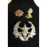 Three assorted military badges