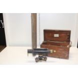 An Antique boxed Theodolite made by Davis of Leeds with stand. Postage unavailable