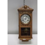 A quality light oak cased wall clock a/f postage unavailable