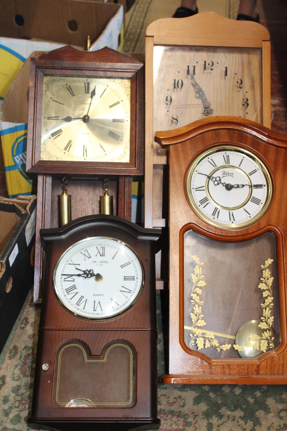 A box of assorted wall clocks a/f postage unavailable