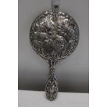 A quality hallmarked silver hand mirror with cherub detail Birmingham 1955 by W I Broadway