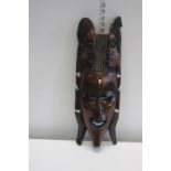 An African hard wood wall hanging mask