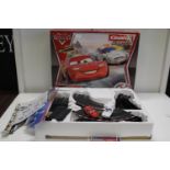 A boxed Disney Cars related Carrera slot car racing game untested