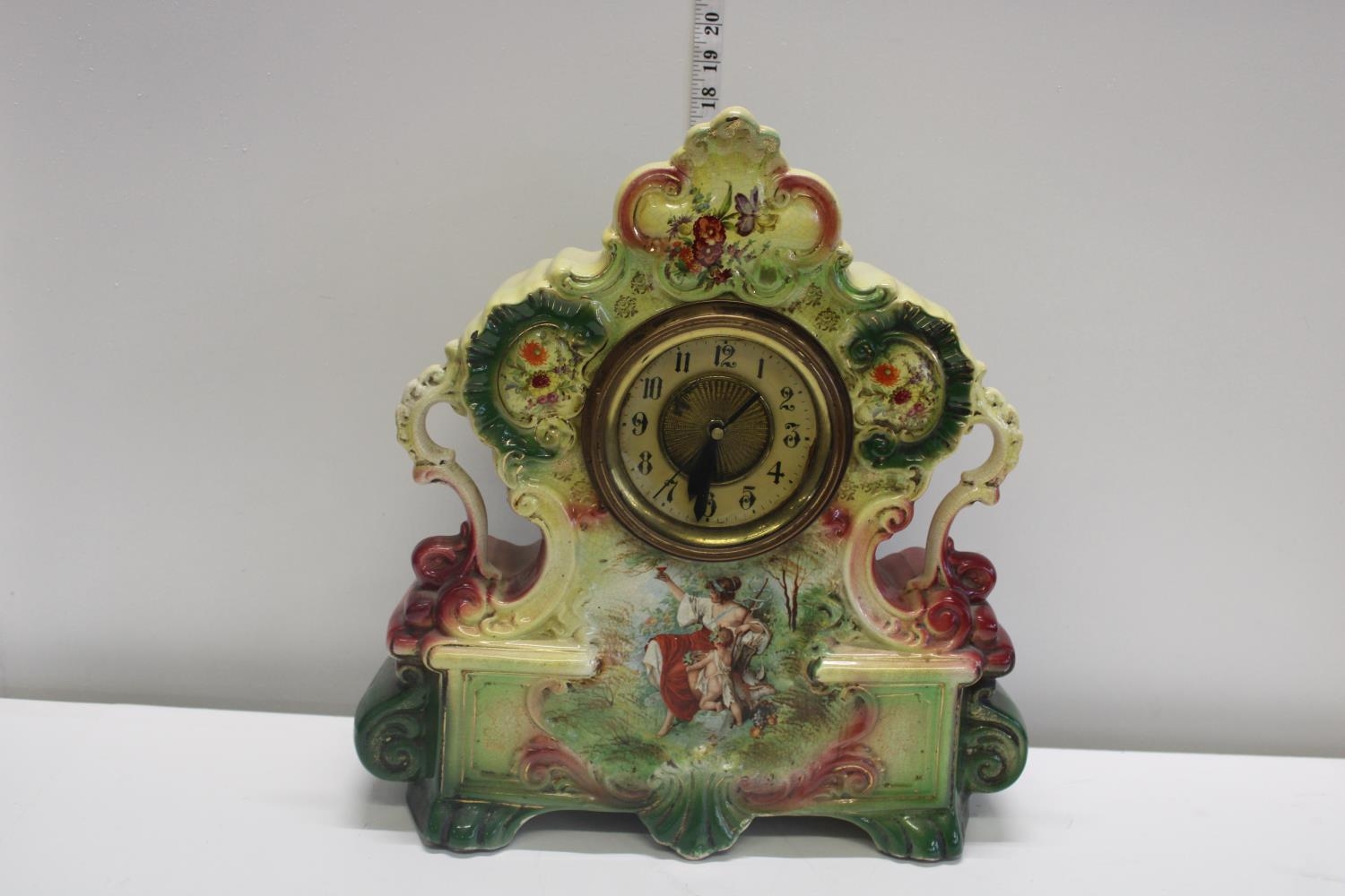 A large late Victorian ceramic mantel clock converted for battery use