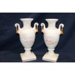 A pair of Staffordshire ceramic urns