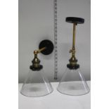 A pair of brass and glass adjustable lights