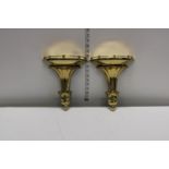 A pair of vintage brass wall sconces