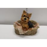 A large Leonardo dog in basket figurine. 27cm tall