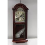 A Tempus Fugit wooden cased wall clock No postage available